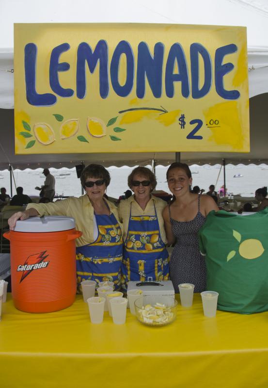 Kathleen renzi, Roni King, and Megan Goulant sell fresh lemonade to raise funds for the Dana Farber Cancer Institute. BY GEORGIA SPARLING